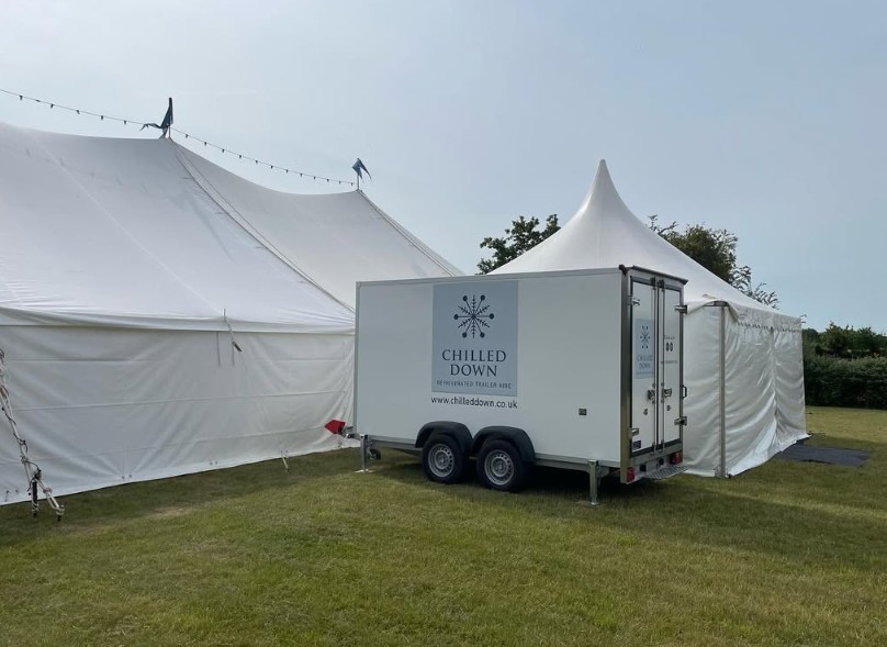 Chilled Down fridge trailer beside a wedding marquee