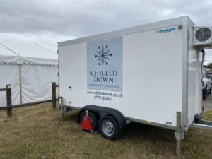 Chilled Down refrigerated trailer at Old Buckenham Air Show with event flags in background
