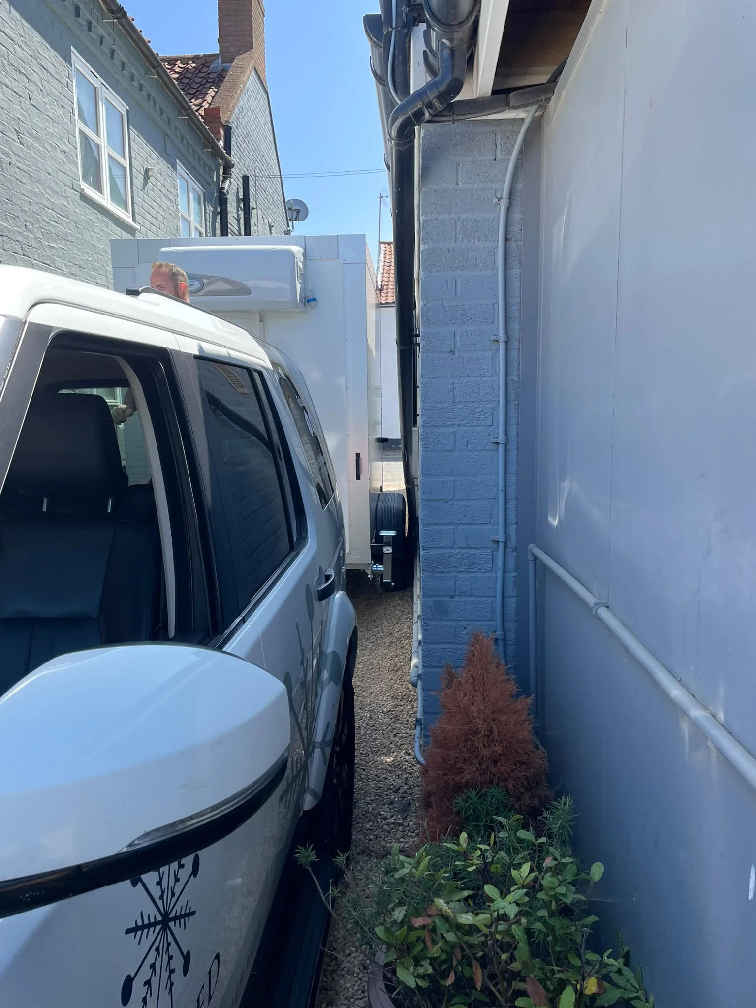 View down narrow access route with refrigerated trailer, Wells, Norfolk