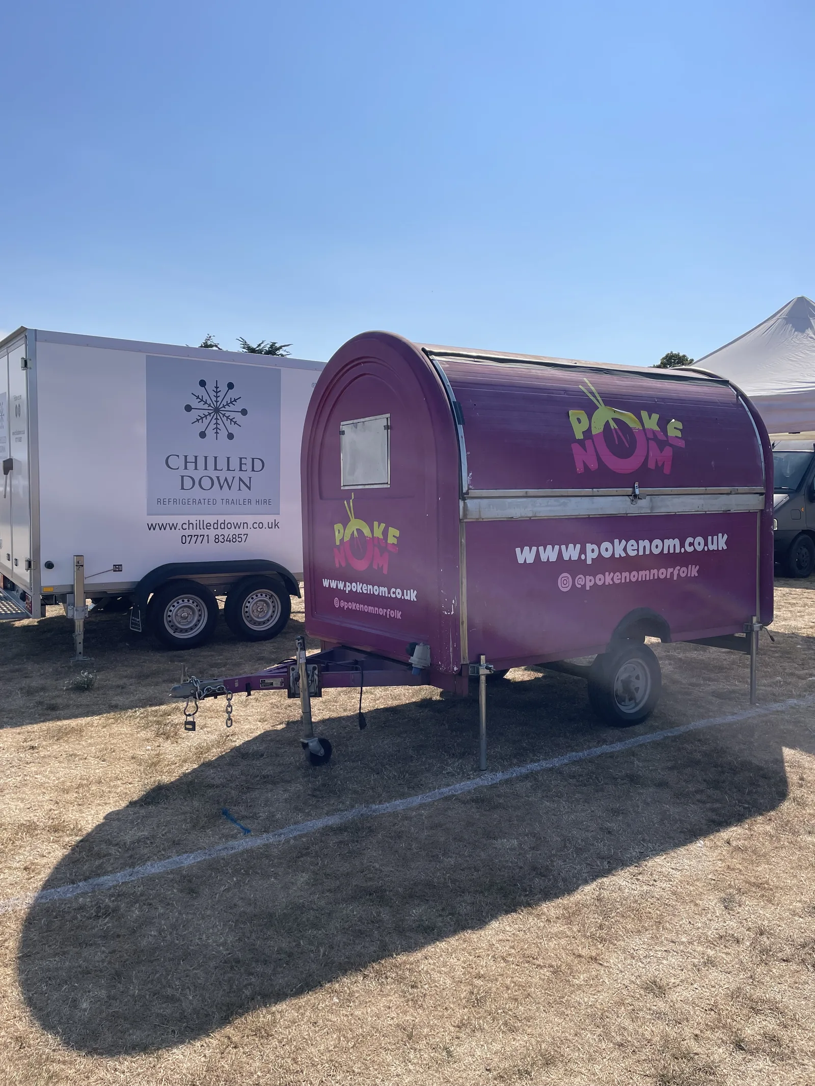 Purple Poke Nom food trailer alongside Chilled Down refrigerated trailer at Tennis Week in Hunstanton